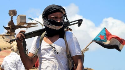 A supporter of Yemen's Southern Separatist Movement stands in front of a tank flying the movement's flag near the international airport in the port city of Aden. Southerners may want to leave the union, but, says Faisal Al Yafai, may soon come to regret it. (AFP PHOTO / SALEH AL-OBEIDI)