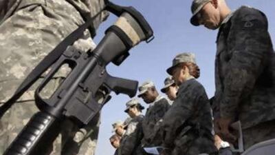 US soldiers in Afghanistan during a moment of silence at a ceremony marking the 7th anniversary of the 9/11 attacks.
