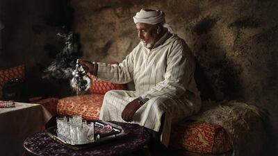 Hajj Saeed, 56, pours tea for guests on February 5, 2016, at his home in the Middle Atlas town of Tounfit, near the province of Midelt, central Morocco.
