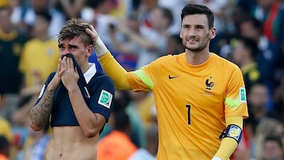 Antoine Griezmann is consoled by France teammate Hugo Lloris after their loss on Friday to Germany in the 2014 World Cup quarter-finals. Adrian Dennis / AFP / July 4, 2014