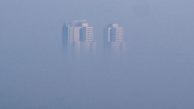 A building is surrounded by smog and pollution in Skopje, North Macedonia, one of the most polluted European capitals. AFP
