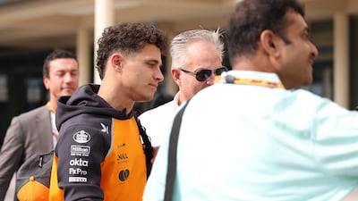 McLaren driver Lando Norris arrives at the Yas Marina Circuit