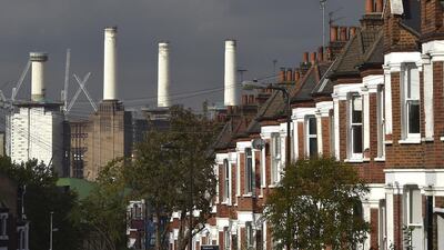 A rig surrounds the top of one of the chimney. Toby Melville / Reuters