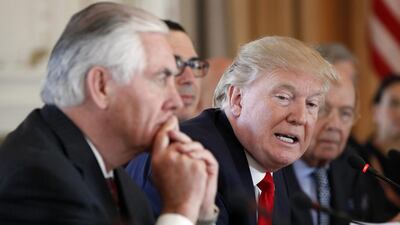 The US President Donald Trump and his secretary of state, Rex Tillerson, left, both said the US missile strikes on a Syrian airbase on April 7, 2017 were strictly a warning to the Assad regime against using chemical weapons. Alex Brandon / AP Photo / April 7, 2017