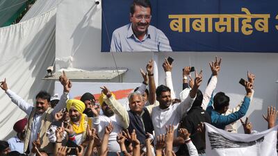 AAP workers celebrate at their party office after the party took the lead during vote counting for the Punjab Assembly election in New Delhi. EPA