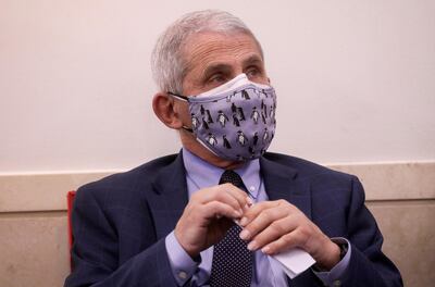 Dr Anthony Fauci, chief scientific adviser to President Joe Biden, has worn two masks. Reuters