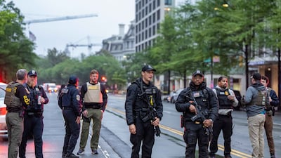 Members of several law enforcement agencies stand at a perimeter around the scene of a shooting near the White House. EPA
