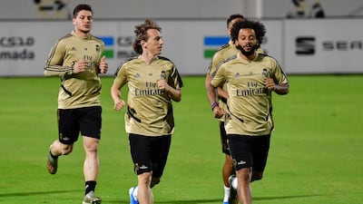 Real Madrid's Luka Modric, front left, and Marcelo, right, warm up during a training session in Jeddah on Tuesday. AFP