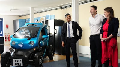 Britain's Prime Minister Rishi Sunak with Wayve Technologies co-founder and chief executive Alex Kendall alongside an autonomous car in London. AFP