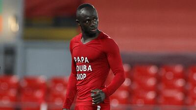 Sadio Mane shows off his under-shirt in memory of countryman Papa Bouba Diop after the former Senegal international died aged 42. EPA