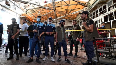 Syrian security forces gather at the site of an explosion at a cafe in the capital Damascus. AFP