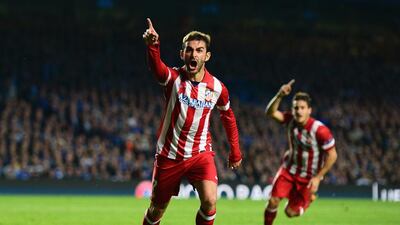 Adrian Lopez of Atletico Madrid celebrates his goal in the Champions League semi-final against Chelsea on Wednesday. Jamie McDonald / Getty Images / April 30, 2014