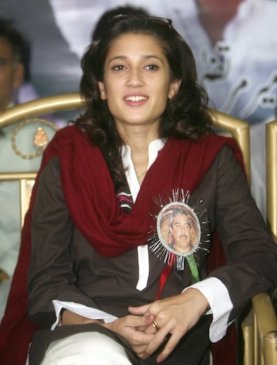 Bhutto in Karachi in 2008, wearing a pin with a picture of her father, Murtaza, who was murdered in 1996. Reuters