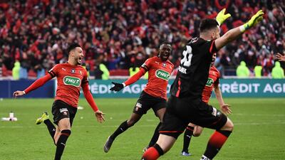 Rennes celebrate after PSG's Christopher Nkunku failed to score during the penalty shootout. Anne-Christine Poujoulat / AFP