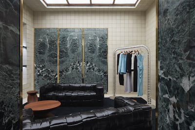 Distinctive Verde Saint Denis marble adorns the walls. Photo: Bottega Veneta