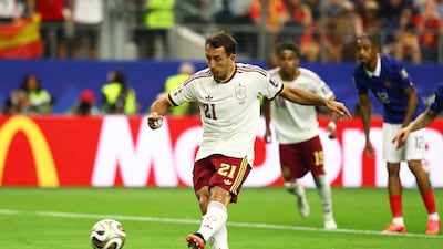 Spain's Mikel Oyarzabal scores their first goal from the penalty spot. Reuters