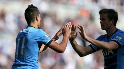 Tottenham Hotspur’s Argentinian midfielder Erik Lamela (L) celebrates with Tottenham Hotspur’s English defender Eric Dier after scoring their first goal during the Premier League match between Newcastle United and Tottenham Hotspur at St James’ Park in Newcastle-upon-Tyne, north east England on May 15, 2016. Scott Heppell / AFP