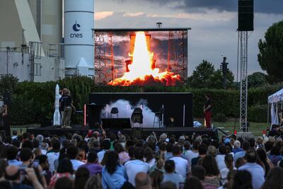 Attendees take part in a public screening projection of the takeoff of the Ariane 6 rocket at the Cite de l'Espace, in Toulouse, south-western France, on July 9, 2024. The Ariane 6 rocket took off on July 9 from its Kourou launch pad, in Guyana, for its inaugural launch intended to qualify in flight the new launcher which should ensure Europe's autonomous access to space, noted a journalist of the AFP. (Photo by Valentine CHAPUIS / AFP)