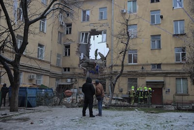Ukrainian rescuers work at a heavily damaged residential building following an air attack in Odesa on January 27. Oleksandr Gimanov / AFP
