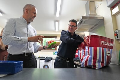 UK Prime Minister Andy Burnham, right, has promised to be open to business. Reuters