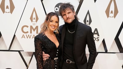 Lead crooner of The Night Game, Martin Johnson, with singer wife Naomi Cooke. AP Photo