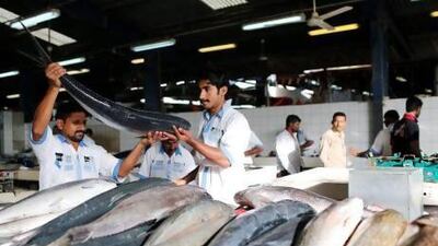 Fishmongers ply their trade in Dubai. Consumer demand is rising and catch levels are higher than national waters can sustainably provide. Ahmed Jadallah / Reuters