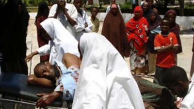 A civilian injured by a mortar round fired into a neighbourhood near the Bakara market, in Mogadishu yesterday, is taken into the local hospital.