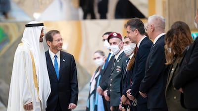 Sheikh Mohamed bin Zayed greets members of the delegation accompanying Isaac Herzog. Mohamed Al Hammadi / Ministry of Presidential Affairs