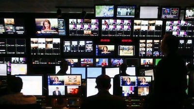 Technicians watch over television monitors and computer screens at Fox.