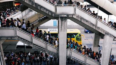 Commuters wait in line to ride the Metro in Quezon City, Metro Manila, Philippines. Dondi Tawatao / Reuters