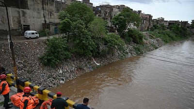 Rescue workers monitor flooding in Rawalpindi on Friday. AFP