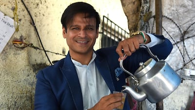 Indian Bollywood actor Vivek Oberoi poses for a picture in a tea stall during the promotion of the biopic Hindi film 'PM Narendra Modi', in Mumbai on May 23, 2019. AFP / STR