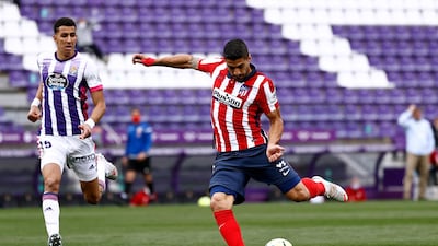 Atletico Madrid's Luis Suarez scores his team's second goal, which handed them the La Liga title on Saturday. Reuters