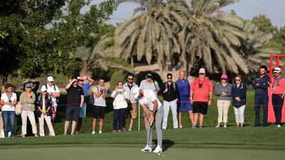 Dustin Johnson putts.