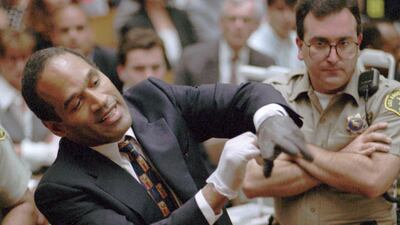In one of the most memorable moments of US legal drama, Simpson tried on the ill-fitting gloves prosecutors said he wore to murder his wife. AP