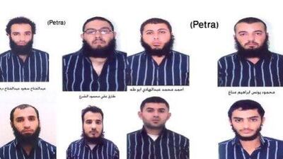 A handout picture released by the Jordanian news agency Petra shows a combo of portraits of eight of 11 suspected members of a group believed to be linked to Al Qaeda who have been arrested in Jordan.