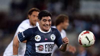 Diego Maradona, centre, plays the ball during the “Match for Peace” game at Rome’s Olympic Stadium on September 1, 2014. Filippo Monteforte / AFP