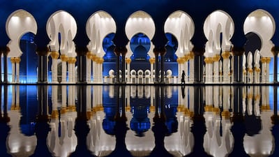 The courtyard of the Sheikh Zayed Grand Mosque in Abu Dhabi at night. The mosque opened to the public on December 20, 2007 Giuseppe Cacace / AFP Photo