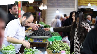 Shoppers at a bazaar in Tehran, where the Iranian leadership says difficult wartime conditions are set to continue. EPA