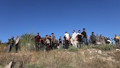 People inspect the site where three Palestinians were killed by Israeli troops near Jenin in the occupied West Bank. EPA