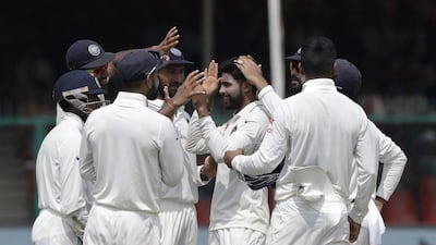 Ravindra Jadeja, centre, led the way for India's bowlers on Day 3 taking five New Zealand wickets. Tsering Topgyal / AP Photo