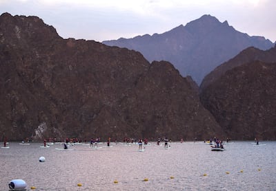 The scenic Hatta Dam backdrop for the group paddle boarding session. Victor Besa / The National