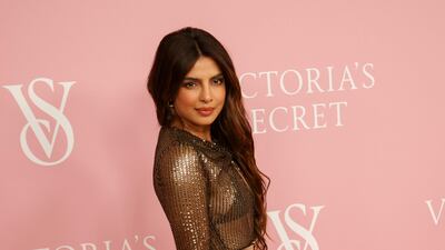 Chopra cleverly opts for a look that is both demure and racy. EPA