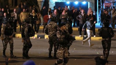 Jordanian gendarmerie policemen stand guard as protesters take part during a demonstration following an announcement that Jordan would raise fuel prices, including a hike on cooking gas. Reuters / Muhammad Hamed