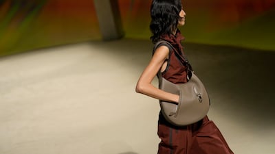 At the Hermes ready-to-wear spring/summer 2023 fashion show, a bag comes with a pocket. AP