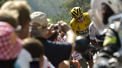 Tour leader Chris Froome, wearing the overall leader's yellow jersey, is blaming 'irresponsible reporting' on the fan backlash he is experiencing at this year's event. Jeff Pachoud / AFP