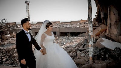 Despite the mass destruction that took place in the city of Sinjar when ISIS invaded the city in 2014, this Yazidi bride and groom have decided to celebrate their wedding in Sinjar. Photo by Sherwan Melhem