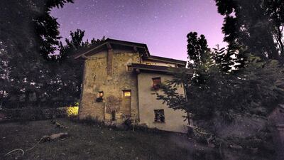 6. This amazing 700-year-old restored barn in Bologna, Italy has a spiral staircase and open fireplace.