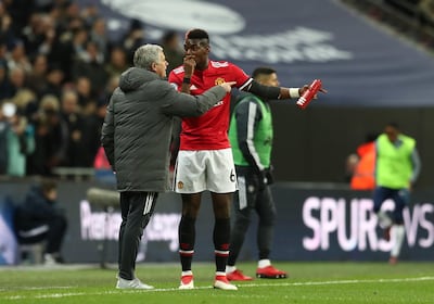 Jose Mourinho says Paul Pogba, right, is still very young and has much to learn. Catherine Ivill / Getty Images