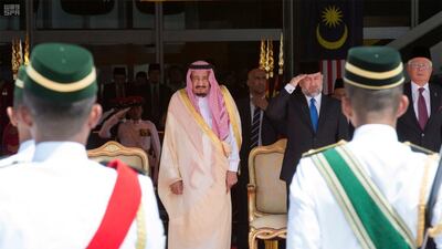 Saudi Arabia’s King Salman, centre, reviewing the honour guard with Malaysia’s King Muhammad V and Malaysia’s prime minister Najib Razak, far right, during a welcome ceremony in Kuala Lumpur, Malaysia on February 26, 2017. Saudi Press Agency/Handout via Reuters